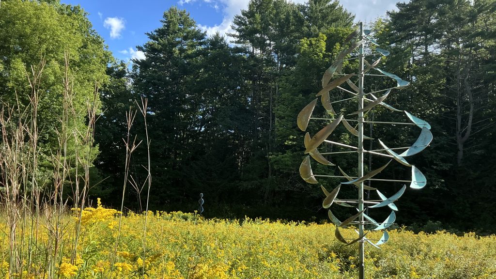 Two kinetic sculptures created by Lyman Whitaker on the Montshire Meadow Loop trail